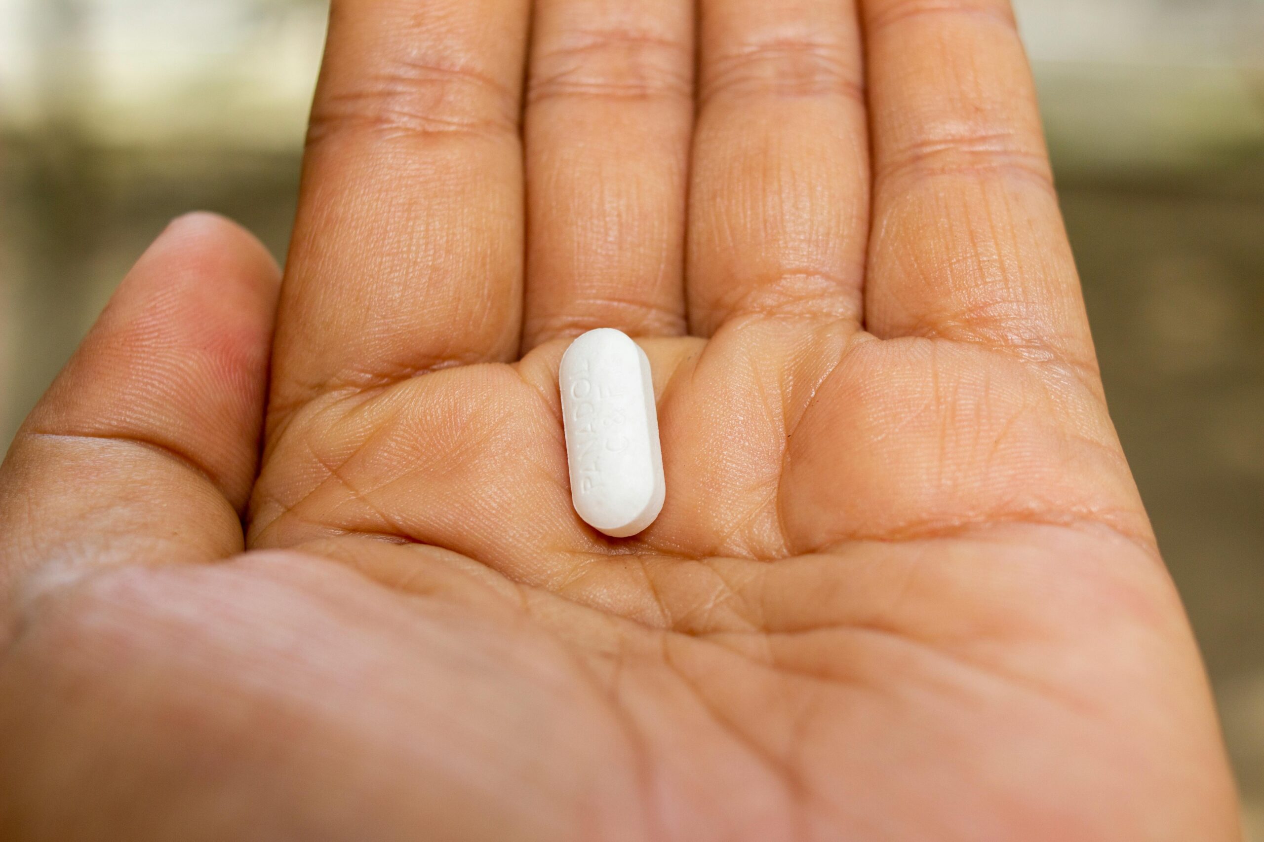 https://www.pexels.com/photo/a-person-holding-white-oval-medication-pill-8637064/