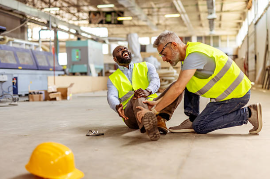 source: https://www.istockphoto.com/photo/workplace-injury-assistance-in-an-industrial-setting-with-safety-gear-gm2212568800-629492484?searchscope=image%2Cfilm