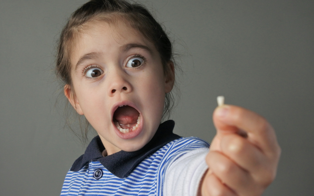 How to Help a Child Through Their First Loose Tooth Without the Tears